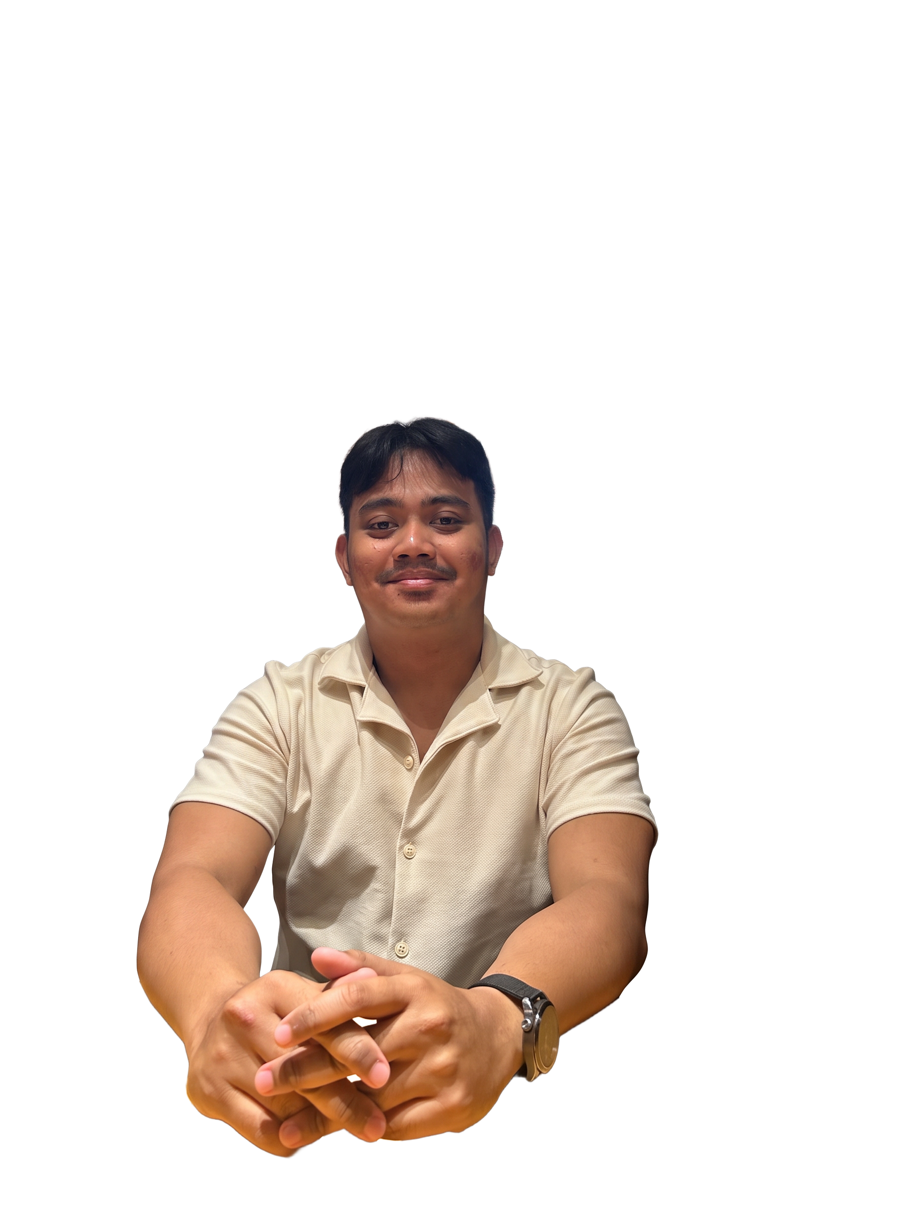 Yoga Adipratama, Founder of Narelle, seated with hands clasped.